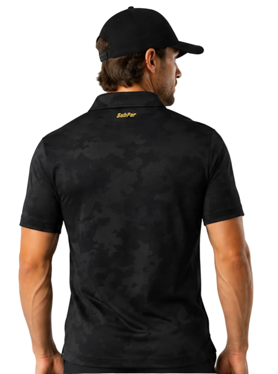A man wearing a black short-sleeve polo shirt with a subtle tonal camouflage pattern on the back and a gold SaltPar logo on the collar, shown from behind against a light gray studio background.